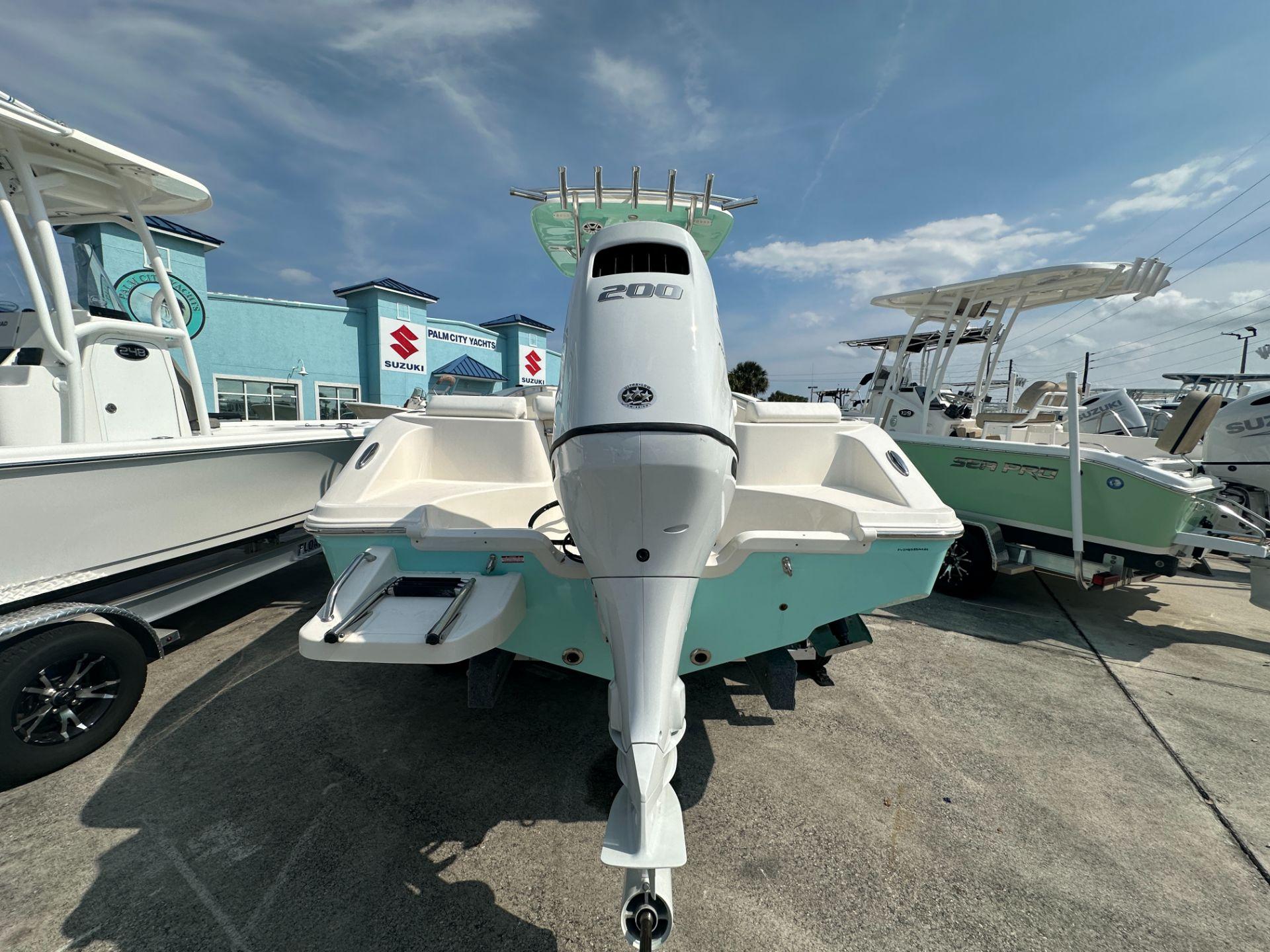 Slide: The Image of 2024 Bulls Bay 230CC boat with 200 HP engine at Palm City Yachts dealership. - 3