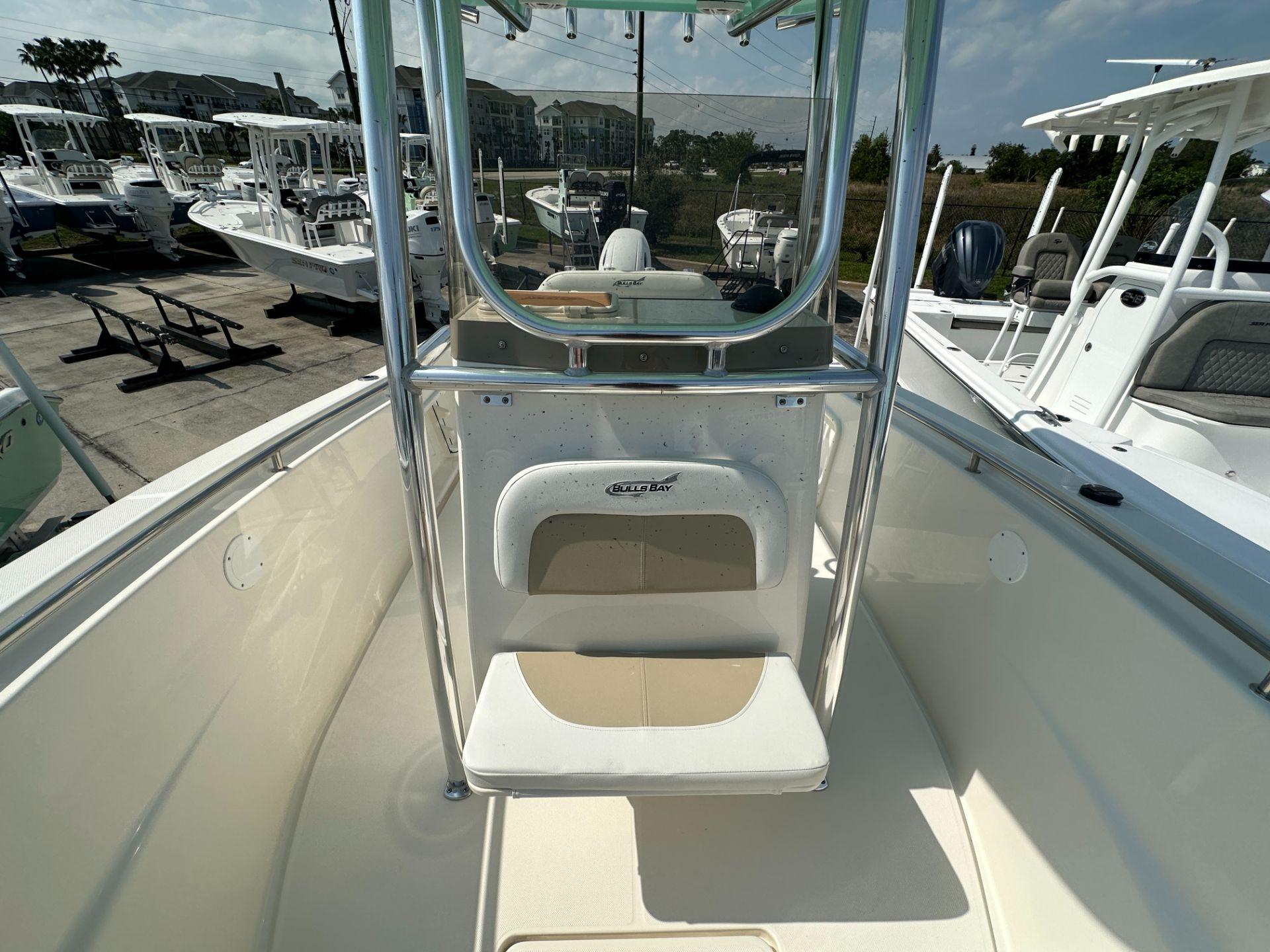 Slide: The Image of 2024 Bulls Bay 230CC center console boat in a marina. - 6