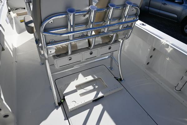 Slide: The Image of 2025 Bulls Bay 255CC boat interior with rod holders and storage compartments. - 13