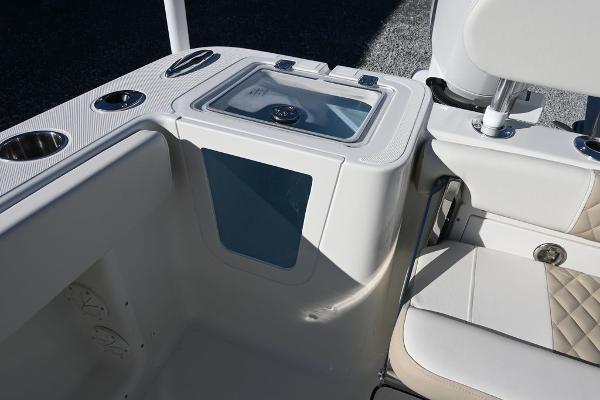 Slide: The Image of 2025 Bulls Bay 255CC boat interior with seating and storage features. - 15