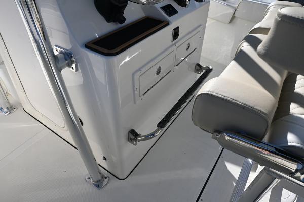 Slide: The Image of 2025 Bulls Bay 255CC boat interior with console and seating area. - 18