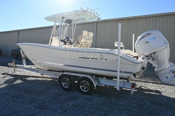 Slide: The Image of 2025 Bulls Bay 255CC boat on trailer with Yamaha outboard motor, parked outdoors. - 4
