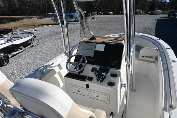 Slide: The Image of 2025 Bulls Bay 255CC boat interior with Garmin navigation system and steering console. - 6