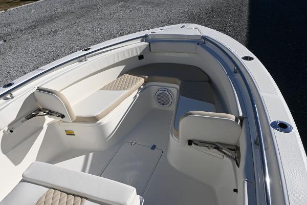 Slide: The Image of 2025 Bulls Bay 255CC boat interior with cushioned seating and storage compartments. - 7