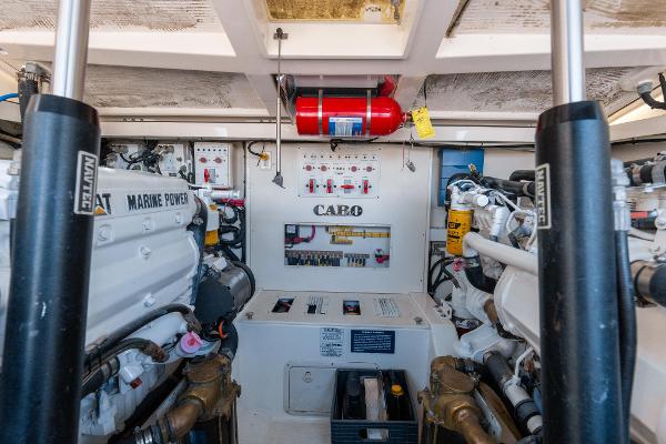 Slide: The Image of Engine room of a 2013 Cabo 36 Express boat with Marine Power engines. - 10