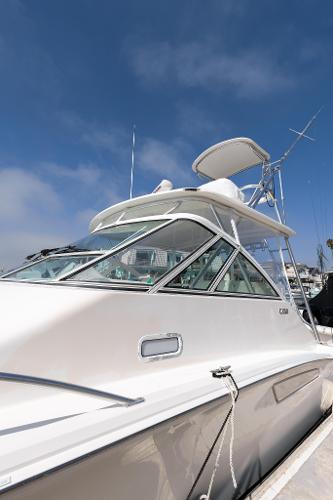 Slide: The Image of 2013 Cabo 36 Express boat docked at marina under clear blue sky. - 25