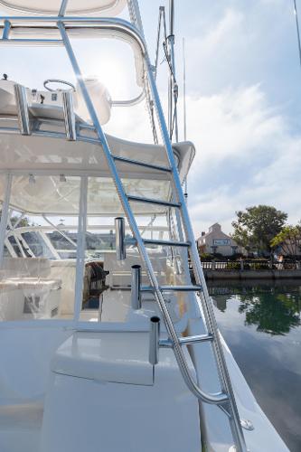 Slide: The Image of 2013 Cabo 36 Express boat with ladder and clear sky background. - 4