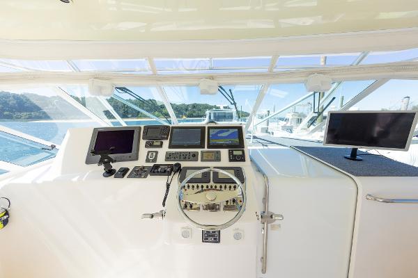 Slide: The Image of Helm of 2005 Cabo 40 Express yacht with navigation equipment and steering wheel. - 13