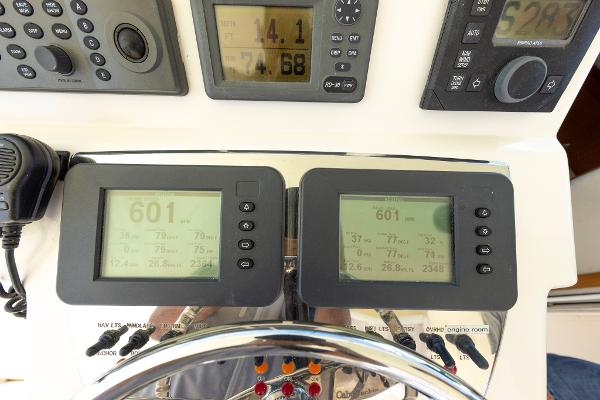 Slide: The Image of Control panel of a 2005 Cabo 40 Express boat with navigation instruments. - 18