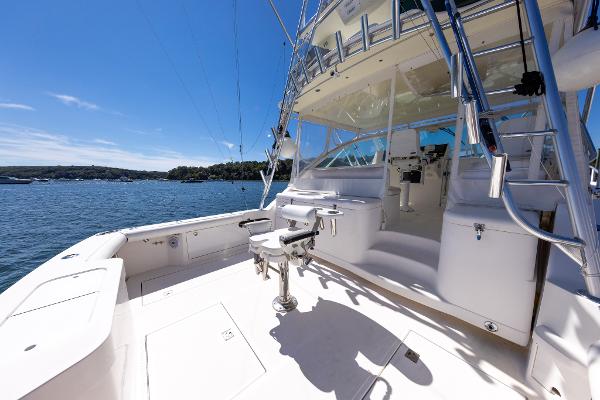 Slide: The Image of 2005 Cabo 40 Express yacht, spacious deck, sunny day, scenic water view. - 19
