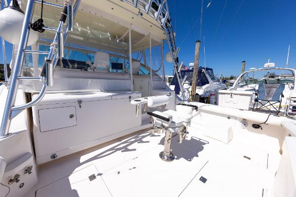 Slide: The Image of 2005 Cabo 40 Express yacht deck with fishing chair and equipment. - 21