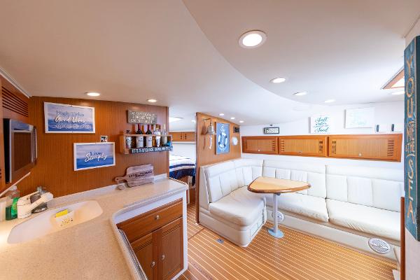 Slide: The Image of Interior of 2005 Cabo 40 Express yacht with cozy seating and modern amenities. - 22