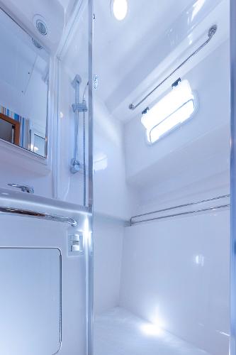 Slide: The Image of 2005 Cabo 40 Express yacht bathroom with modern fixtures and bright lighting. - 32