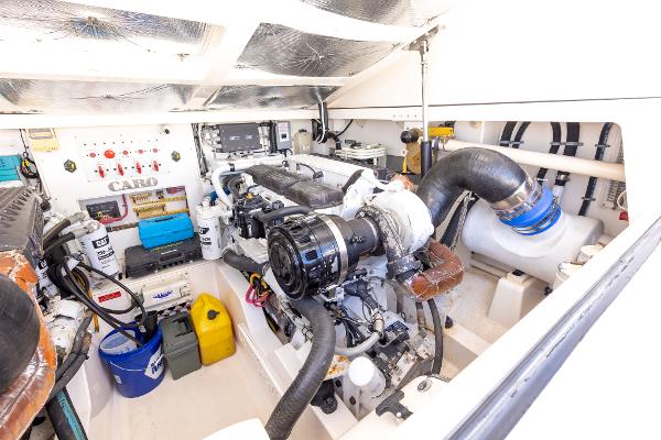 Slide: The Image of Engine room of 2005 Cabo 40 Express boat, showcasing mechanical components and equipment. - 35