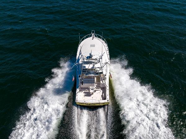 Slide: The Image of Cabo 40 Express 2005 boat cruising on open water, aerial view. - 43