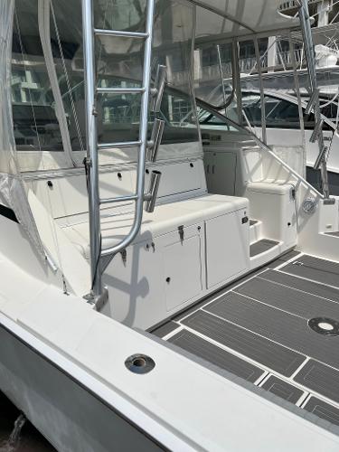 Slide: The Image of 1998 Cabo 45 Express boat with spacious deck and seating area. - 15