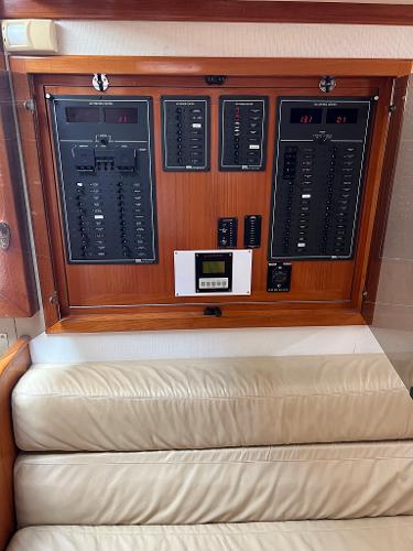Slide: The Image of Electrical control panel on a 1998 Cabo 45 Express boat. - 19