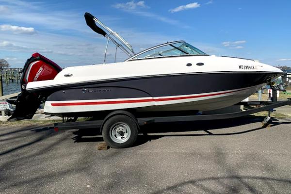 Slide: The Image of 2017 Campion Allante 595 Sport Cabin boat on trailer by the waterfront. - 1