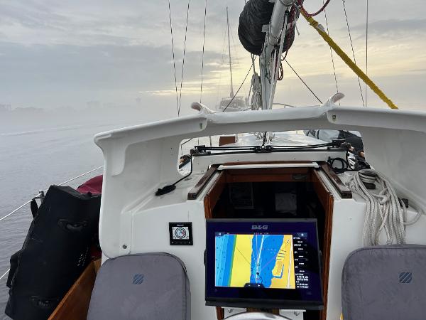 Slide: The Image of Cockpit view of a 1985 Cape Dory 270 sailboat with navigation equipment. - 44