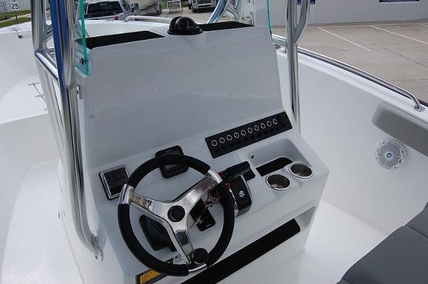 Slide: The Image of 2025 Cape Horn 22 OS boat console with steering wheel and controls. - 3