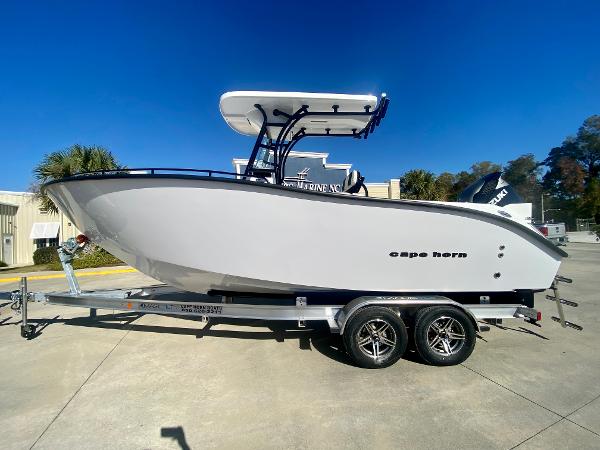 Slide: The Image of 2024 Cape Horn 22OS boat on a trailer, side view, outdoors. - 0