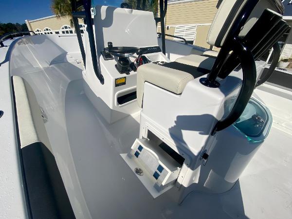 Slide: The Image of 2024 Cape Horn 22OS boat interior with console and seating. - 15