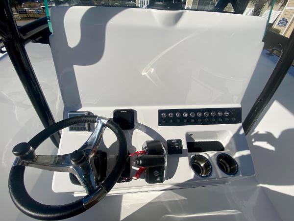 Slide: The Image of 2024 Cape Horn 22OS boat dashboard with steering wheel and control panel. - 17