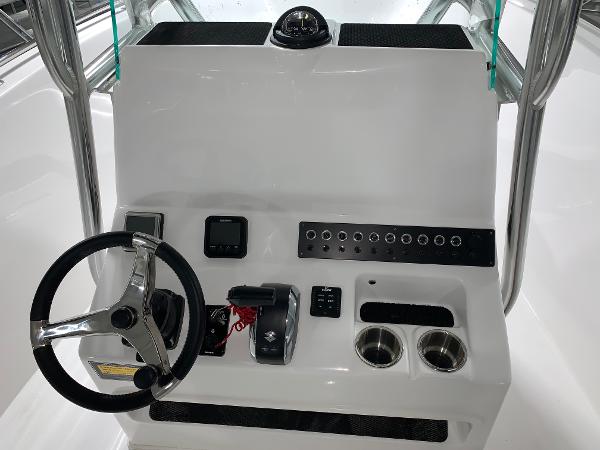 Slide: The Image of 2024 Cape Horn 22 OS boat console with steering wheel and control panel. - 6