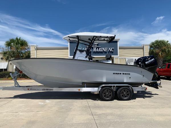 Slide: The Image of 2024 Cape Horn 24 XS boat on trailer outside dealership. - 0