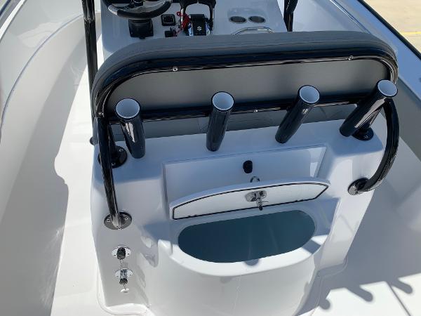 Slide: The Image of 2024 Cape Horn 24 XS boat console with rod holders and storage compartment. - 13