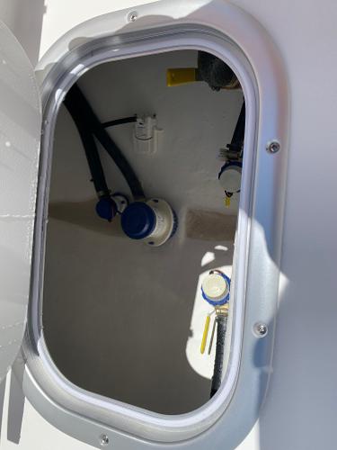 Slide: The Image of Hatch compartment of 2024 Cape Horn 24 XS boat showing internal components. - 16