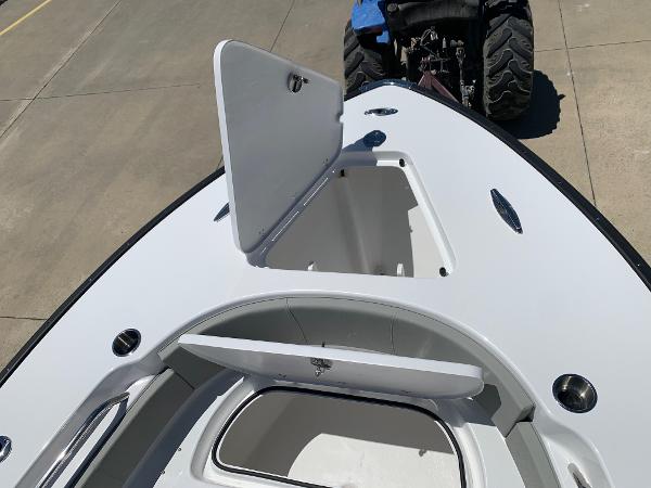 Slide: The Image of 2024 Cape Horn 24 XS boat with open storage compartments. - 20