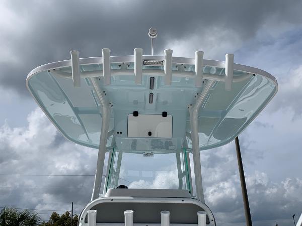 Slide: The Image of 2024 Cape Horn 24 XS boat with rod holders and T-top against cloudy sky. - 4
