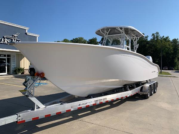 Slide: The Image of 2024 Cape Horn 31T boat on trailer in dealership lot. - 0