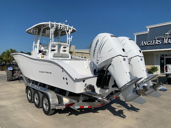 Slide: The Image of 2024 Cape Horn 31T boat with dual outboard engines on a trailer at Anglers Marine. - 1