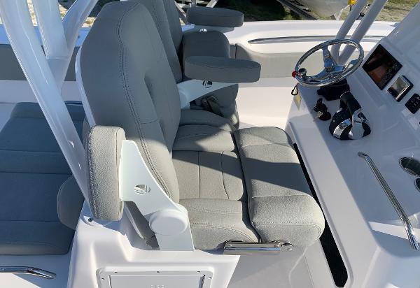 Slide: The Image of 2024 Cape Horn 31T boat interior with dual captain's chairs and steering console. - 10