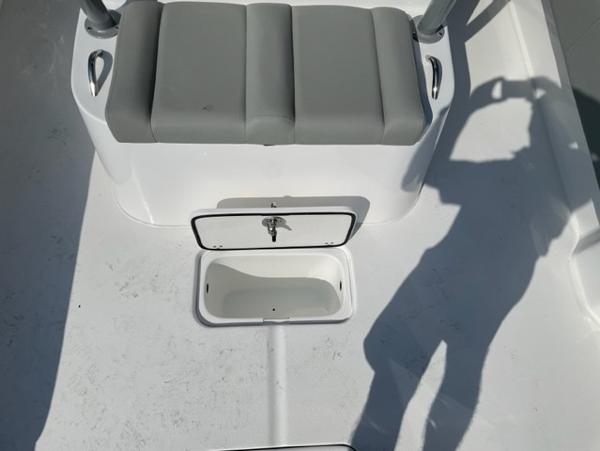 Slide: The Image of 2024 Cape Horn 31T boat interior with seating and storage compartment. - 11