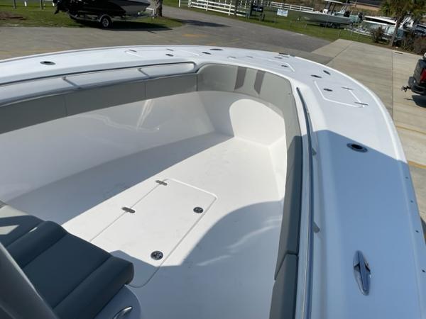 Slide: The Image of 2024 Cape Horn 31T boat interior, spacious deck with seating and storage compartments. - 23