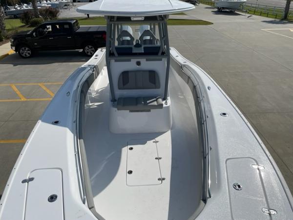 Slide: The Image of 2024 Cape Horn 31T center console boat, front deck view, parked on concrete lot. - 33