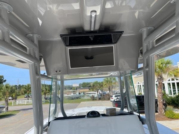 Slide: The Image of 2024 Cape Horn 31T boat console with overhead electronics and windshield. - 18
