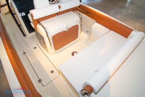Slide: The Image of 2024 Capoforte SX280I boat interior with white and brown seating. - 16