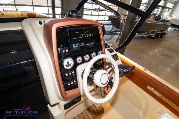 Slide: The Image of 2024 Capoforte SX280I boat dashboard with steering wheel and control panel. - 27