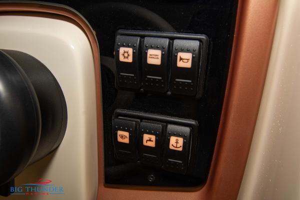 Slide: The Image of Control panel of 2024 Capoforte SX280I boat with various switches. - 34