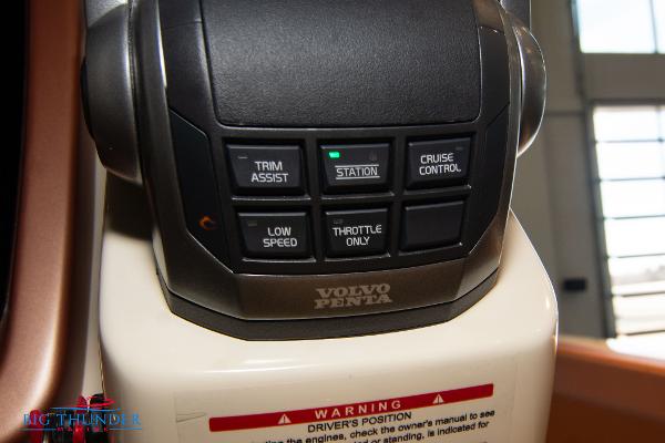 Slide: The Image of Close-up of 2024 Capoforte SX280I boat control panel with Volvo Penta buttons. - 39