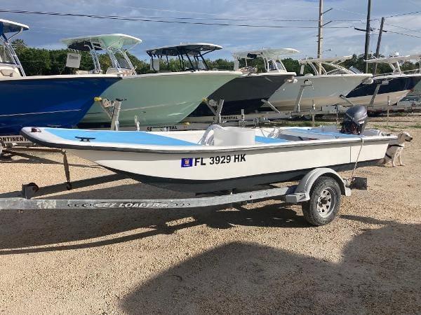 Slide: The Image of 1997 Carolina Skiff 16 DLX boat on trailer in a boatyard. - 0