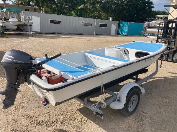 Slide: The Image of 1997 Carolina Skiff 16 DLX boat on trailer with Yamaha outboard motor. - 2