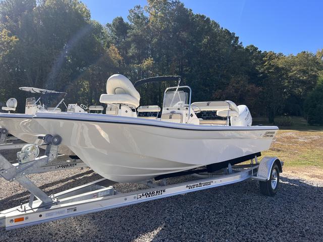 Slide: The Image of 2024 Carolina Skiff 178 JLS boat on a Load Rite trailer in outdoor setting. - 1