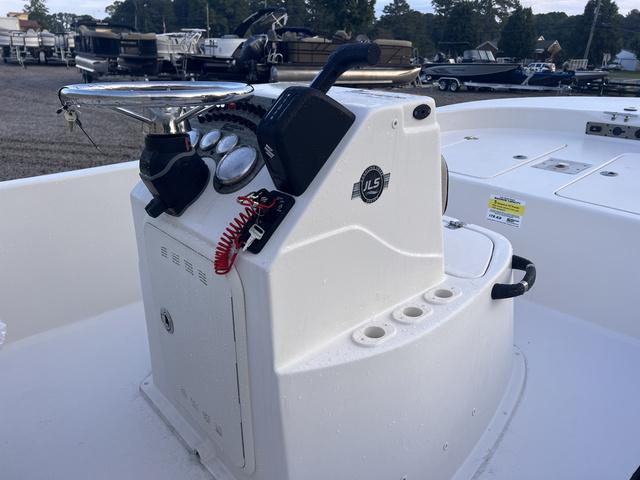 Slide: The Image of 2024 Carolina Skiff 178 JLS boat console with steering wheel and controls. - 4