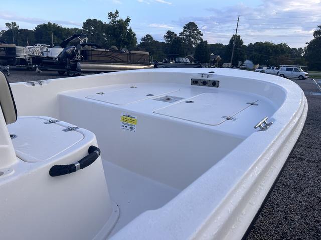 Slide: The Image of 2024 Carolina Skiff 178 JLS boat interior, white deck, and storage compartments. - 5