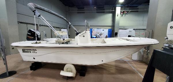 Slide: The Image of 2023 Carolina Skiff 17 LS boat on display indoors. - 1